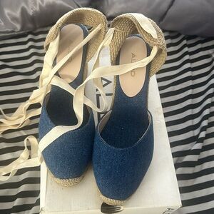 Brand new Aldo shoes denim. They tie up the ankle not for wide feet.